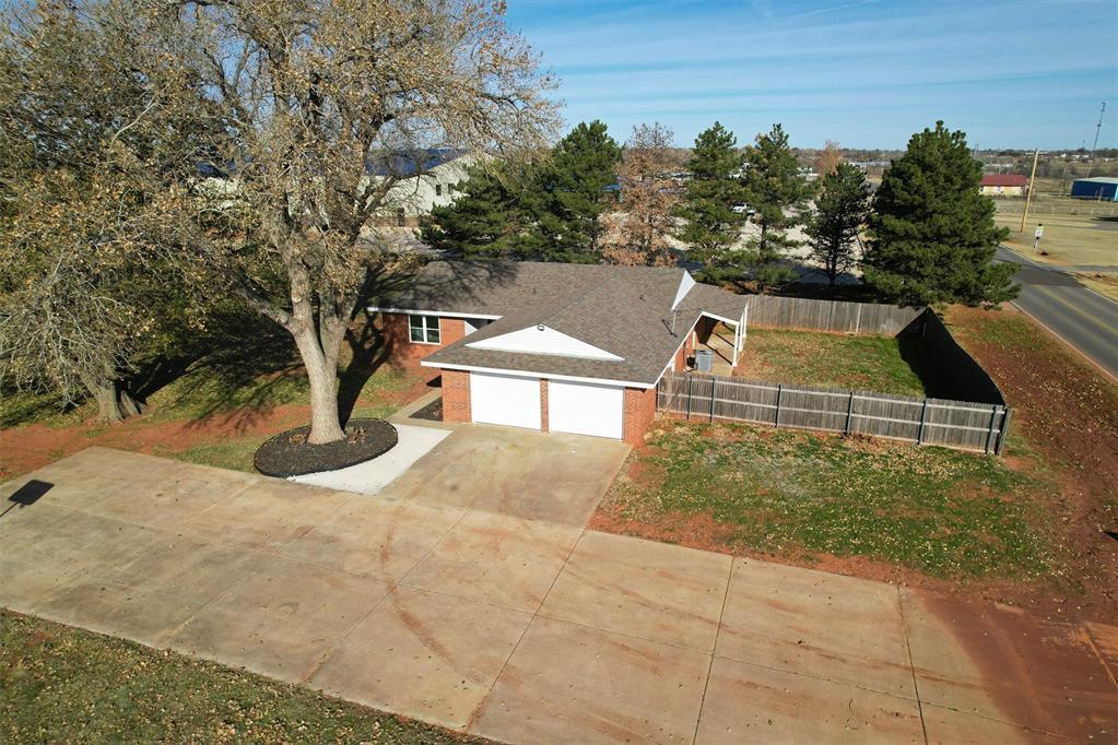 view of front of property with a front yard and a garage