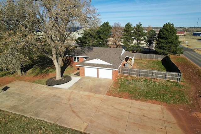 view of front of property with a front yard and a garage