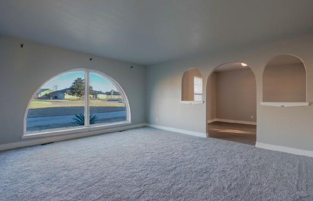 unfurnished room featuring carpet