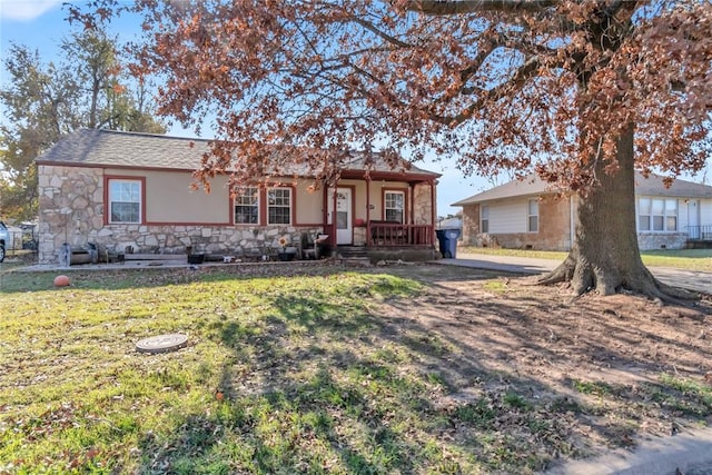 single story home with covered porch and a front lawn