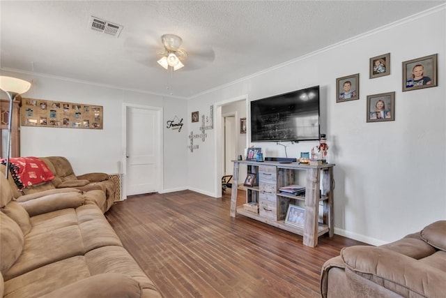 living room featuring ceiling fan, crown molding, a textured ceiling, and hardwood / wood-style flooring