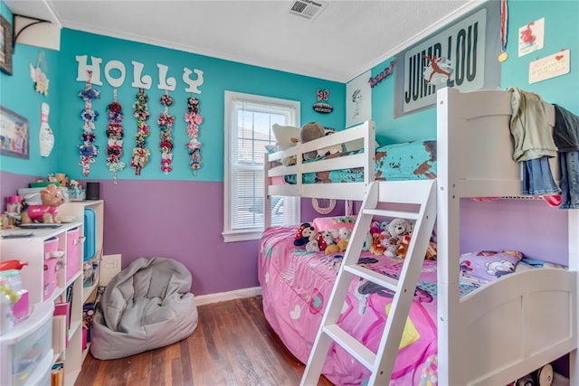 bedroom featuring dark hardwood / wood-style flooring