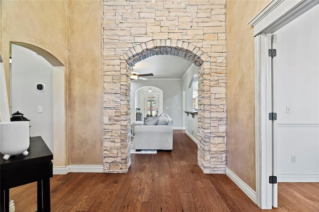 hallway featuring hardwood / wood-style floors and ornamental molding