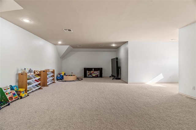 recreation room with carpet flooring