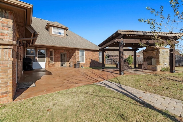 view of yard featuring a patio area and exterior fireplace