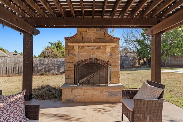 view of patio with an outdoor stone fireplace