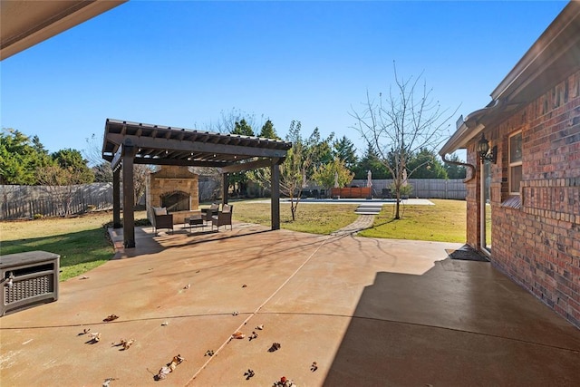 view of patio featuring an outdoor stone fireplace