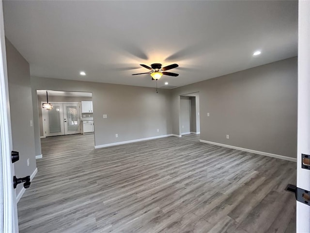 spare room featuring hardwood / wood-style floors and ceiling fan