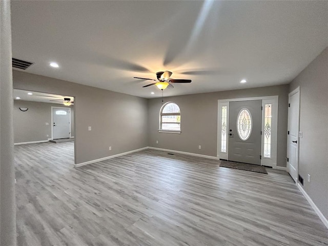 foyer featuring light hardwood / wood-style flooring and ceiling fan