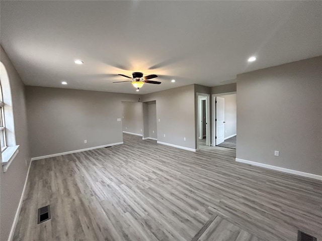 empty room featuring light hardwood / wood-style floors and ceiling fan