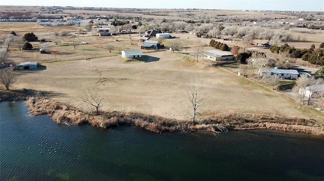 birds eye view of property featuring a rural view and a water view