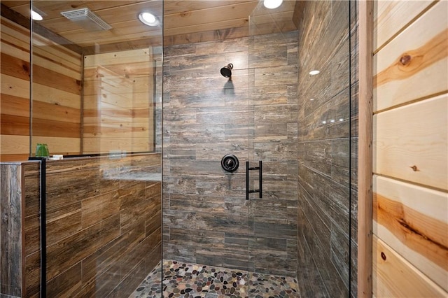 bathroom with a shower with shower door