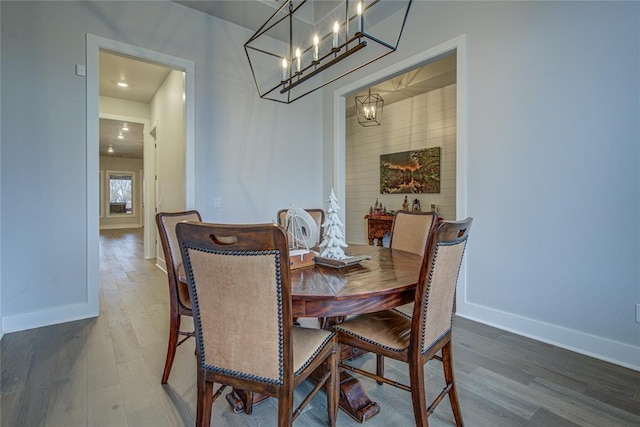 dining space featuring a chandelier and wood-type flooring