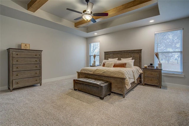 bedroom with ceiling fan, light carpet, and multiple windows