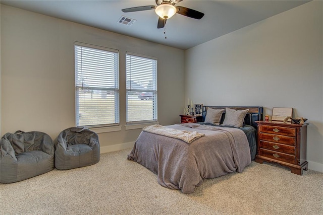 bedroom with ceiling fan and carpet