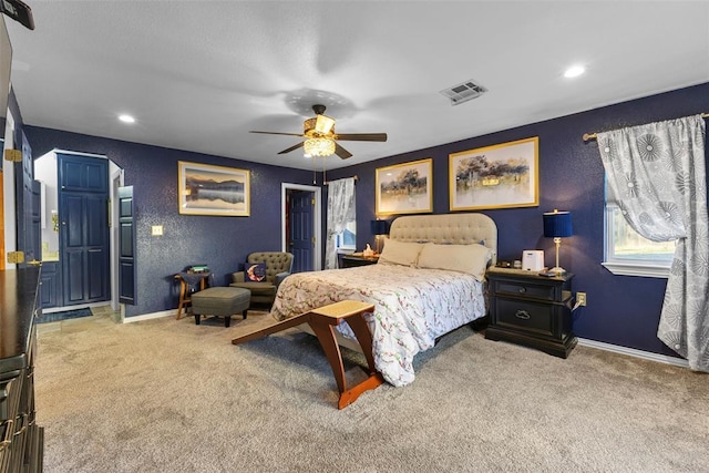 carpeted bedroom with ceiling fan