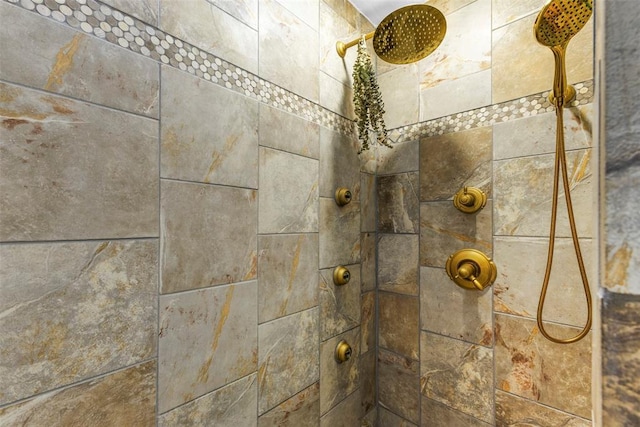 interior details with a tile shower