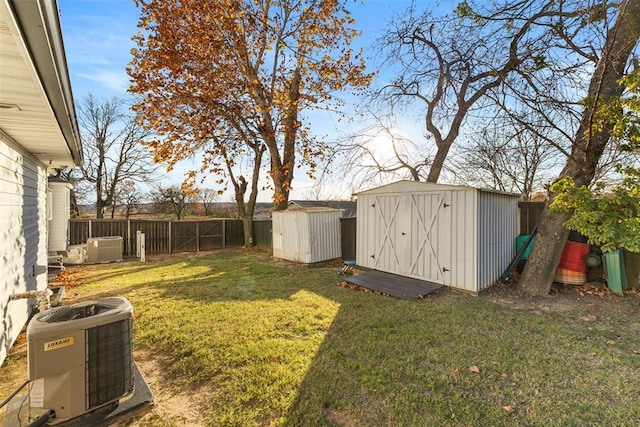 view of yard with cooling unit and a storage shed