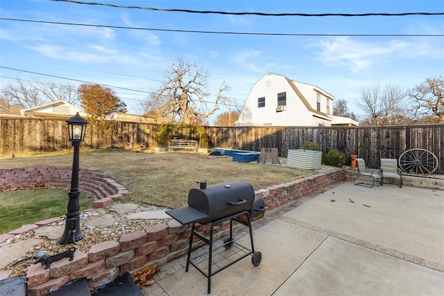 view of patio with a grill