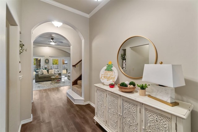 hallway with crown molding, dark hardwood / wood-style flooring, and french doors