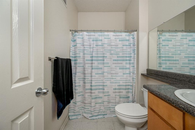 bathroom with vanity, a shower with shower curtain, tile patterned flooring, toilet, and a textured ceiling