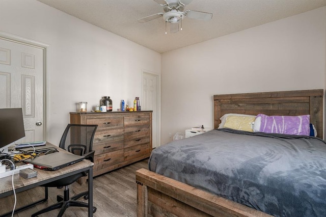 bedroom featuring ceiling fan and hardwood / wood-style flooring