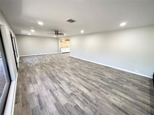 interior space with ceiling fan and wood-type flooring