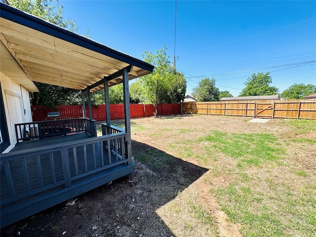 view of yard featuring a wooden deck