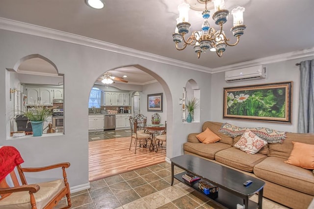 living room with ceiling fan with notable chandelier, a wall mounted AC, crown molding, dark wood-type flooring, and sink