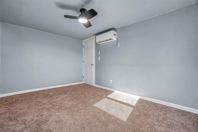 carpeted empty room featuring a wall unit AC and ceiling fan