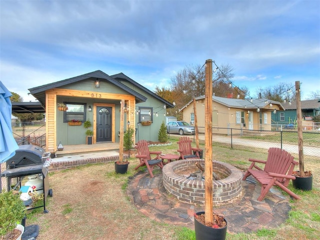 view of front of house with a fire pit