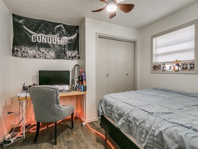 bedroom featuring a closet, hardwood / wood-style flooring, and ceiling fan