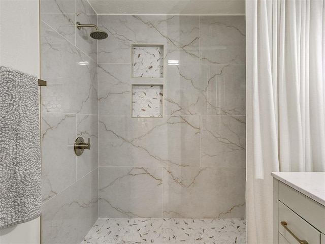 bathroom featuring vanity and walk in shower