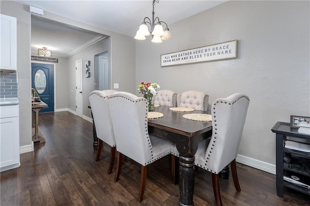 dining room with crown molding, dark hardwood / wood-style floors, and an inviting chandelier