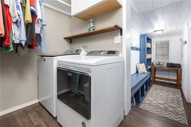 laundry room featuring dark hardwood / wood-style flooring and washing machine and dryer