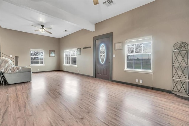 entrance foyer featuring ceiling fan, light hardwood / wood-style flooring, and beamed ceiling