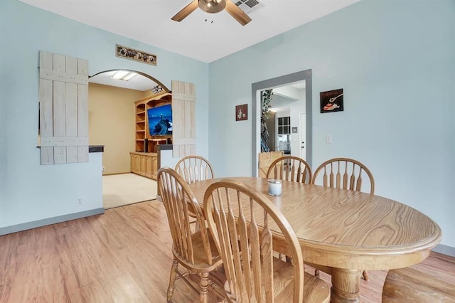 dining room featuring light hardwood / wood-style floors and ceiling fan