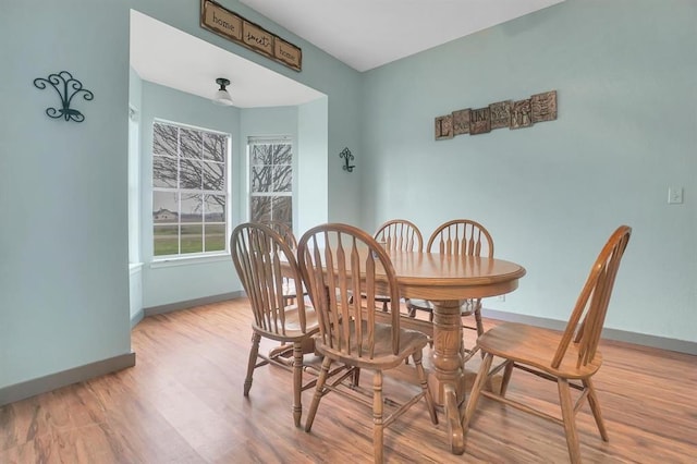 dining area with light hardwood / wood-style floors