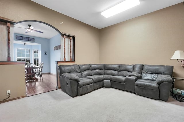 living room with carpet floors and ceiling fan