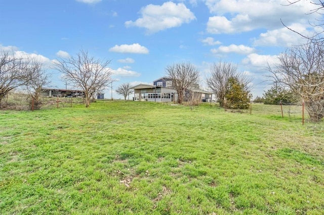 view of yard with a rural view