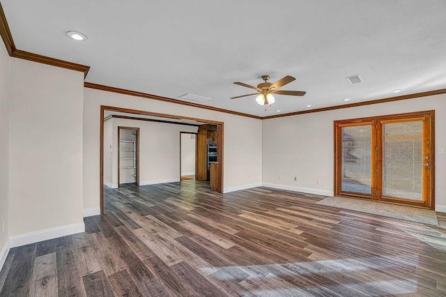 empty room with ceiling fan, dark wood-type flooring, and ornamental molding