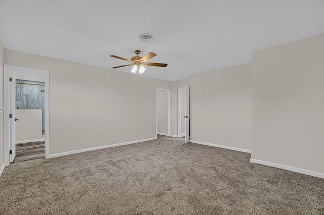 empty room with carpet flooring and ceiling fan