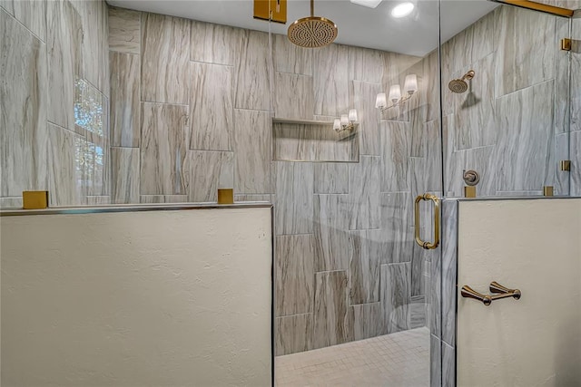 bathroom featuring a shower with door