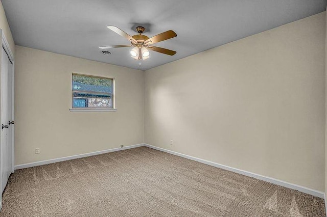 carpeted empty room with ceiling fan