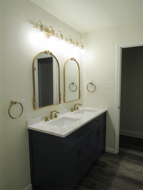 bathroom featuring vanity and wood-type flooring