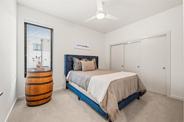 bedroom featuring carpet, a closet, and ceiling fan