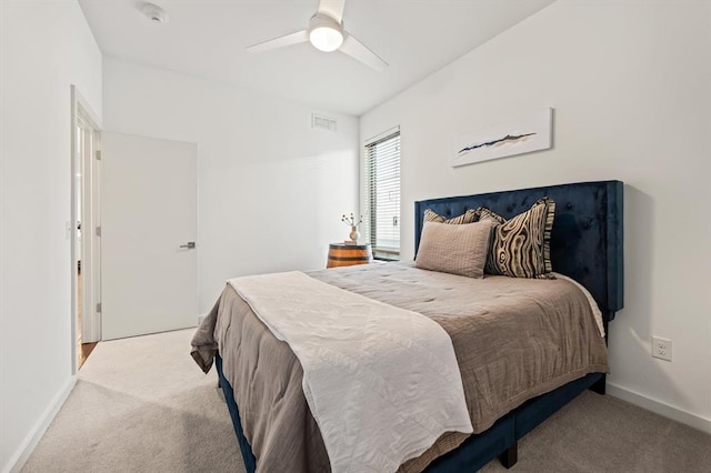 bedroom with light carpet and ceiling fan