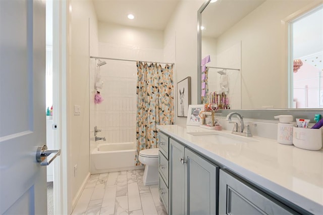 full bathroom featuring shower / tub combo with curtain, vanity, and toilet