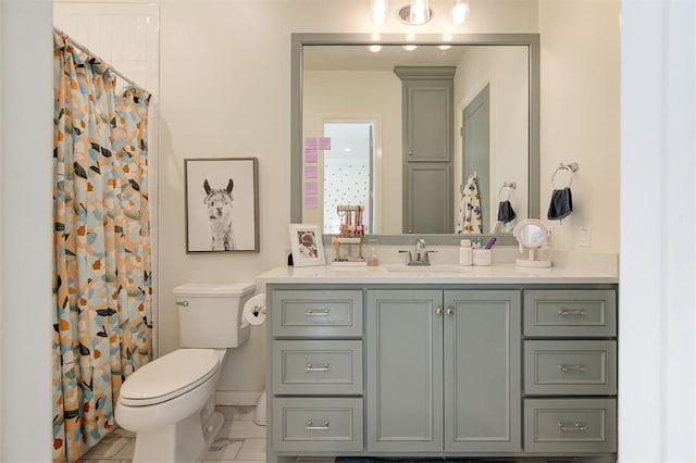 bathroom with vanity, toilet, and walk in shower