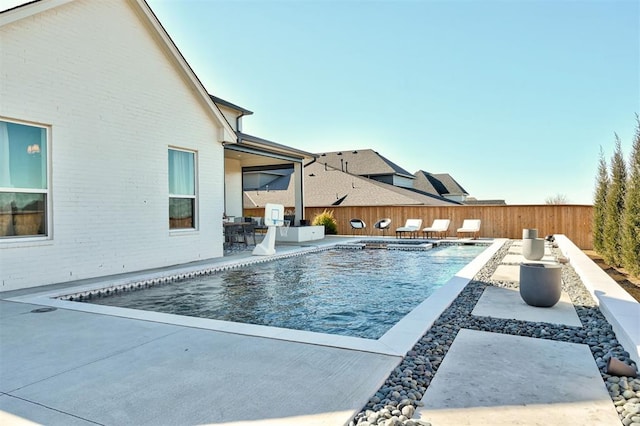 view of swimming pool featuring a patio